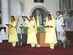 The triple arati done with (L to R) a plate of flowers, fire and incense sticks